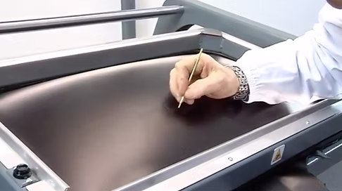 Step 3 — micro-defects revealed on the stretched leather surface