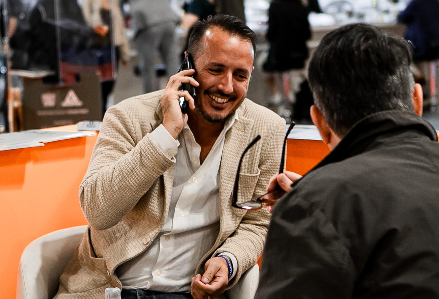 Kymera Group representative meeting a client at the stand