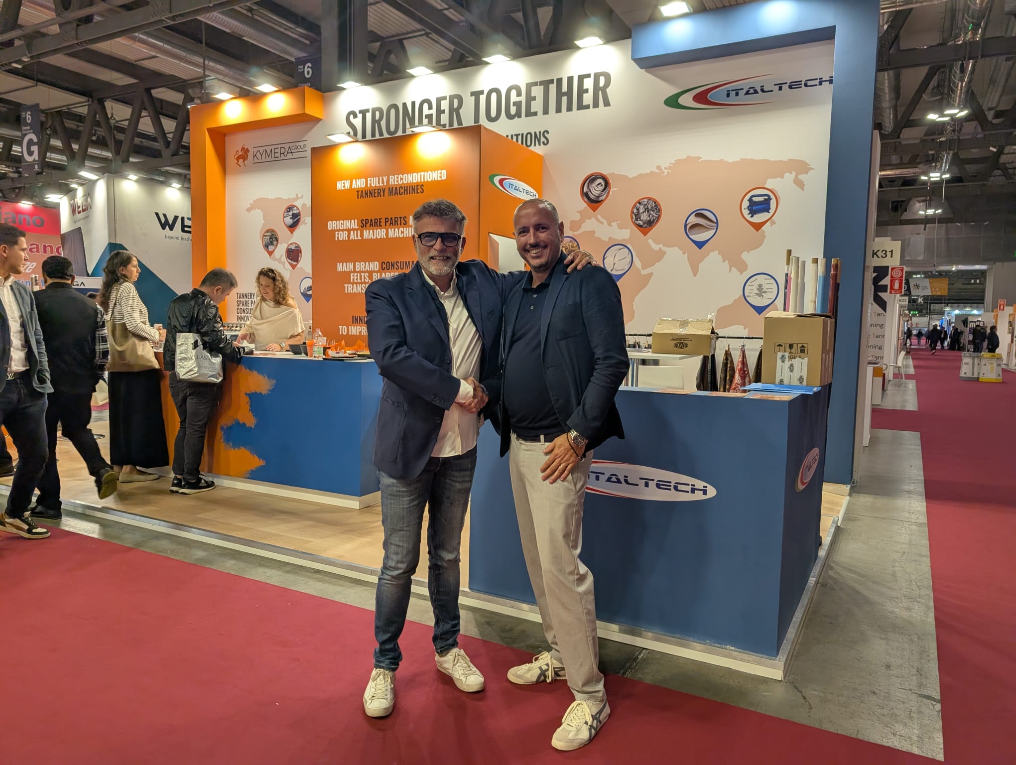 Kymera Group partnership handshake at the Italtech stand